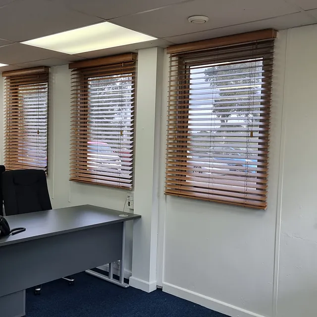 Wooden venetian blinds in an office